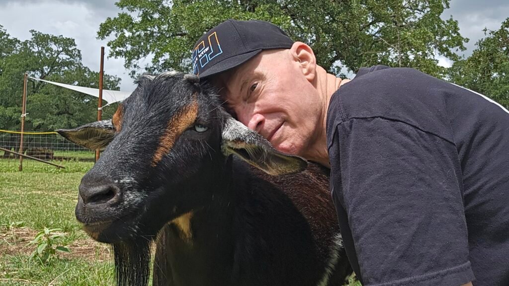 Ken+Bill_AFS_16x9 DR. Ken with Bill the goat at Austin Farm Sanctuary